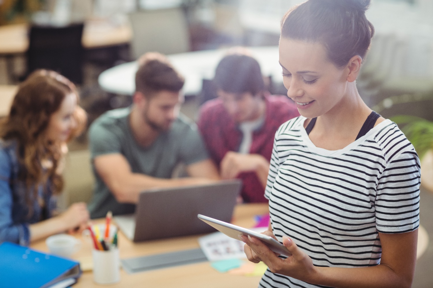 Students with various digital devices